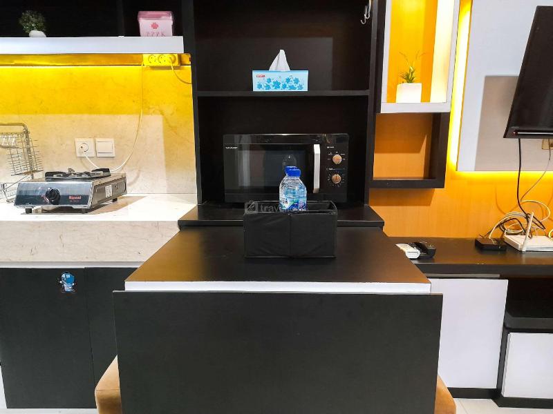 Brand New and Good Simply 1BR at Uttara The Icon Apartment By Travelio - image 13