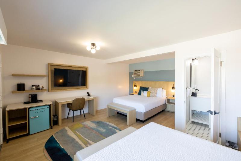 Two Queen Beds with Partial Ocean View image 1
