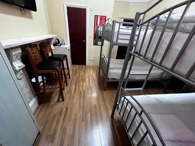 Quadruple Room with Private Bathroom image 2