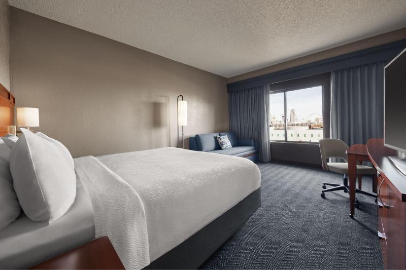Deluxe King Room with Sofa Bed and View image 1