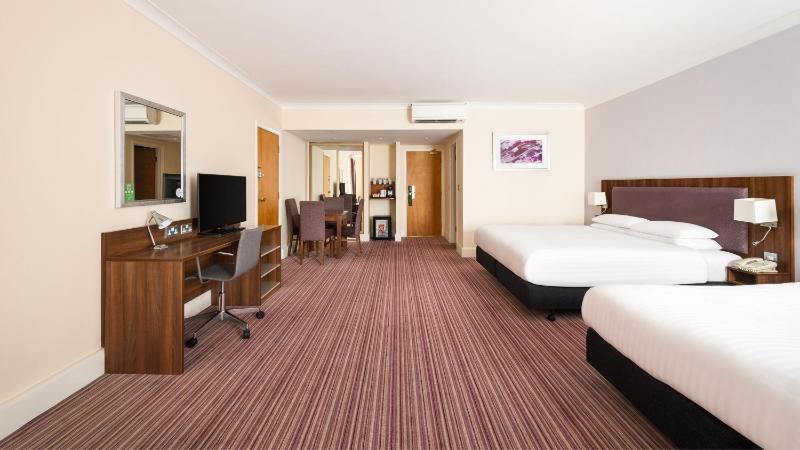 Premium Queen Room with Two Queens and One Sofa Bed image 4