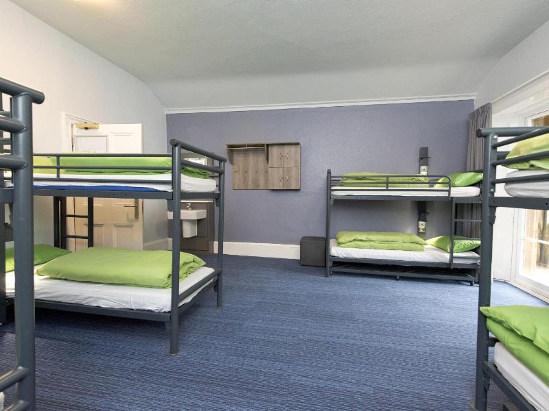 Bunk Bed in Male Dormitory Room with Shared Bathroom image 1