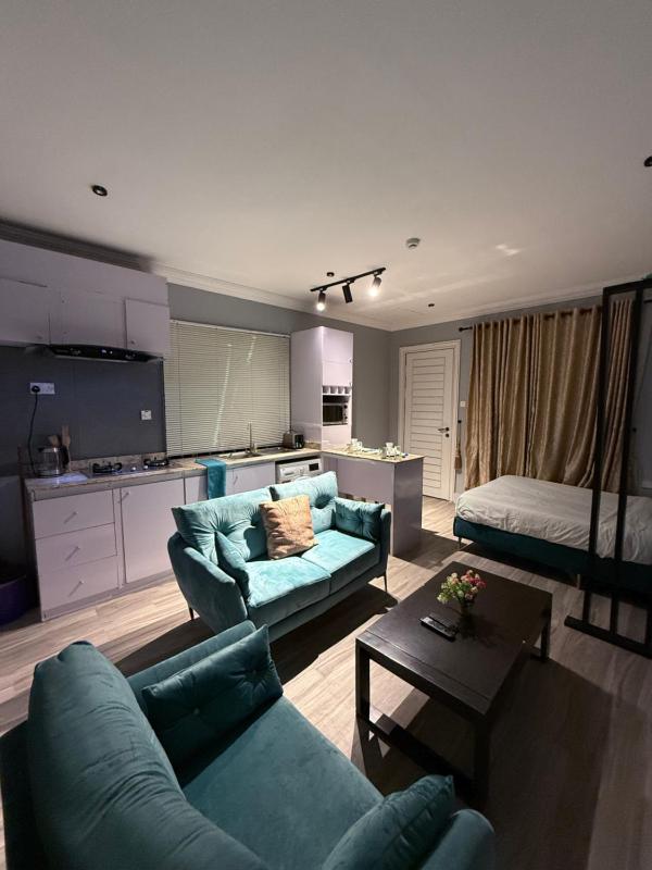 Balcony Teal Snug Open-Plan Studio Unit in Lekki Phase 1-Netflix Wi-Fi 24-7 Light Washer Kitchen - image 9