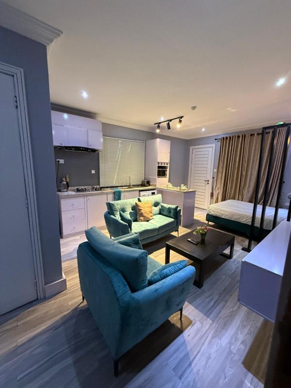 Balcony Teal Snug Open-Plan Studio Unit in Lekki Phase 1-Netflix Wi-Fi 24-7 Light Washer Kitchen - image 5