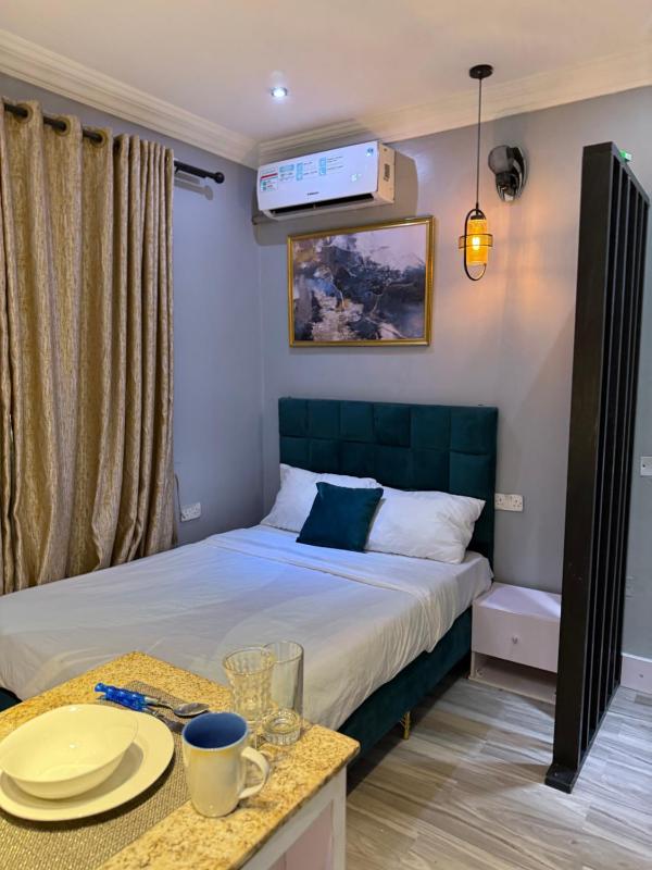 Balcony Teal Snug Open-Plan Studio Unit in Lekki Phase 1-Netflix Wi-Fi 24-7 Light Washer Kitchen - image 13