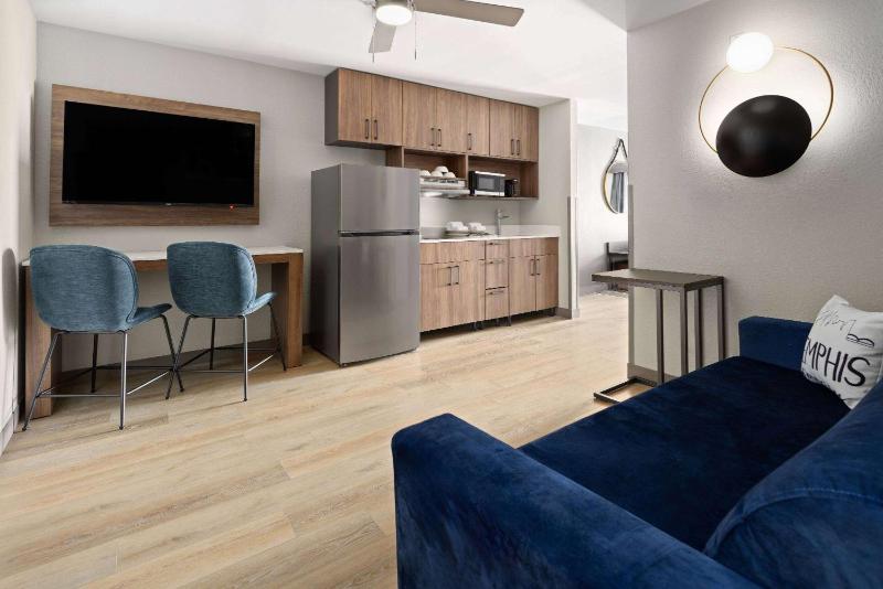 Deluxe King Room with One King Bed and Sofa Bed - Large Living Room and Kitchen - Non-Smoking image 3