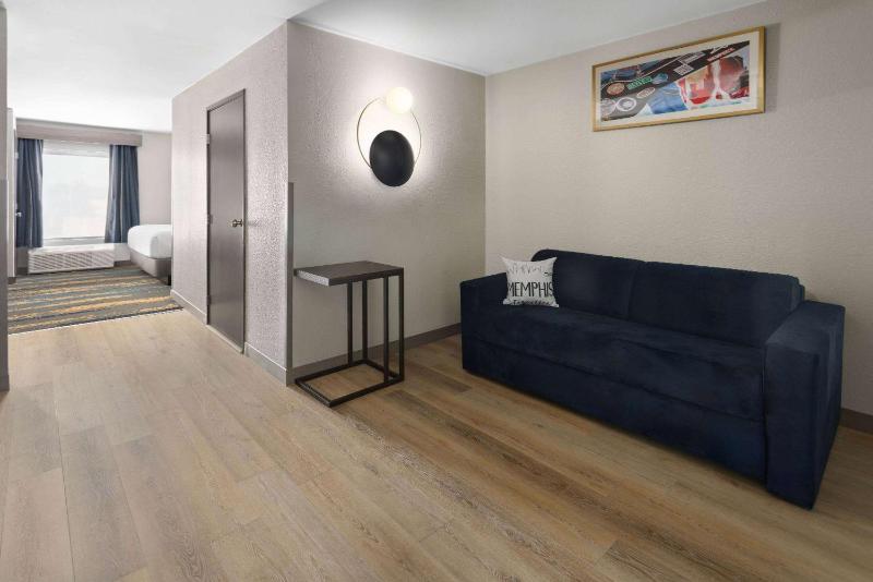 Deluxe King Room with One King Bed and Sofa Bed - Large Living Room and Kitchen - Non-Smoking image 2