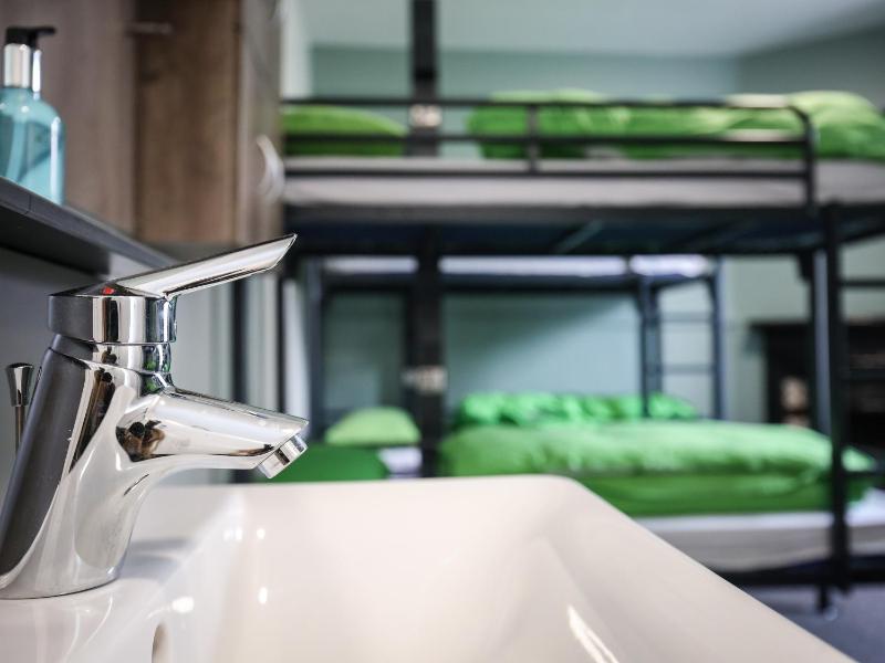 Bunk Bed in Male Dormitory Room with Shared Bathroom image 1
