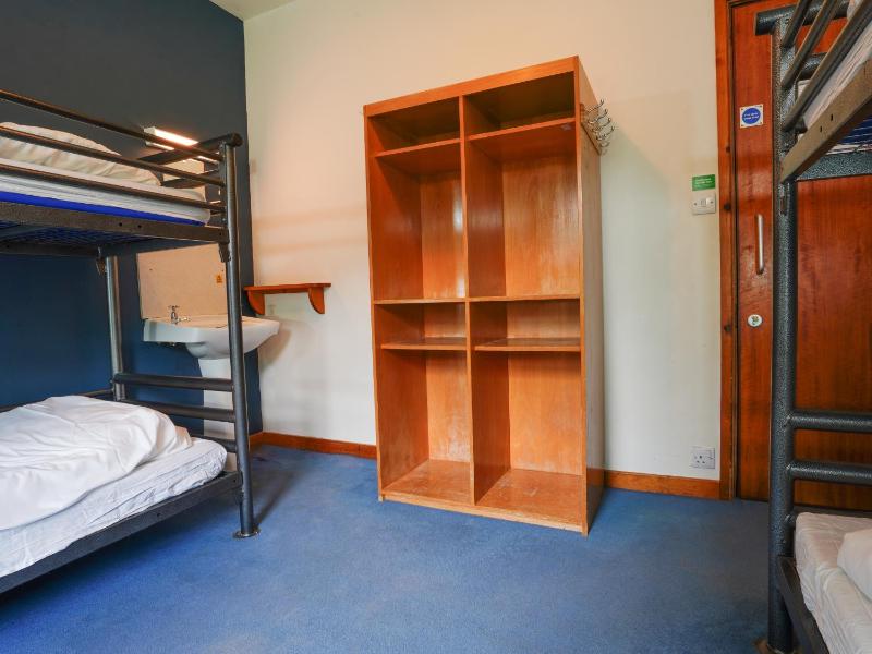 Bunk Bed in Male Dormitory Room with Shared Bathroom image 1