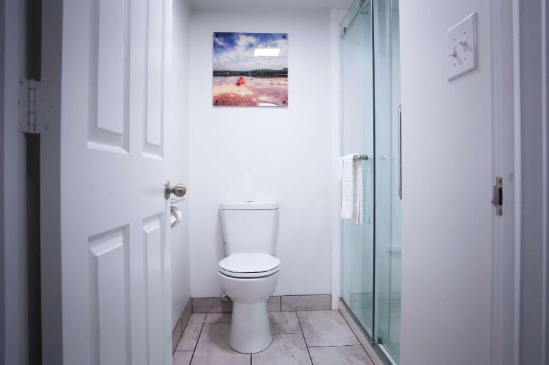 Queen Room with Two Queen Beds and Walk-In Shower image 4