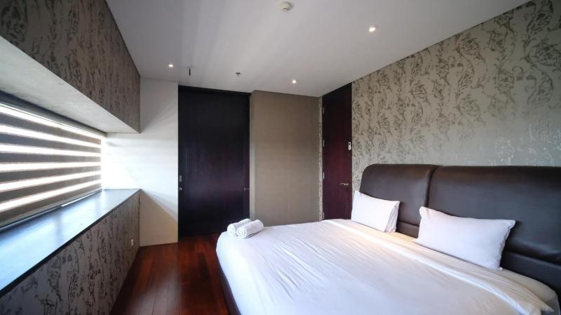 Spacious and Restful 2BR at Sumatra36 Apartment By Travelio - image 1