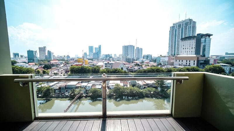Spacious and Restful 2BR at Sumatra36 Apartment By Travelio - image 13