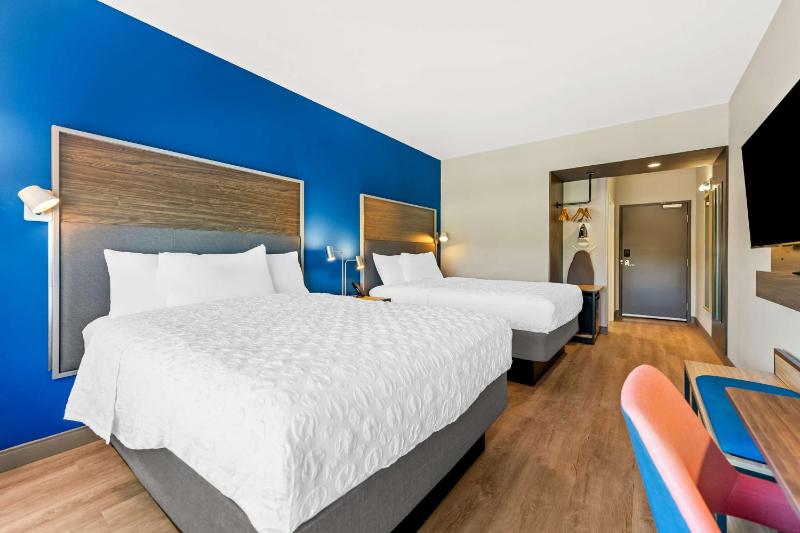 Queen Room with Two Queen Beds and Walk-In Shower image 4