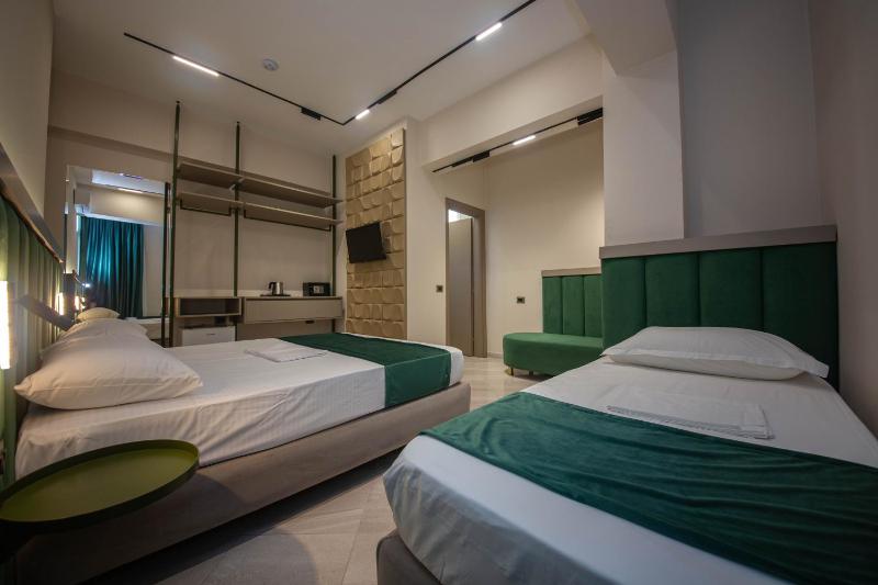 Superior Triple Room with Balcony and Side Sea View image 1