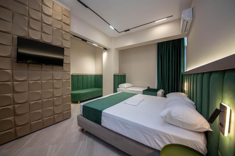 Superior Triple Room with Balcony and Side Sea View image 3