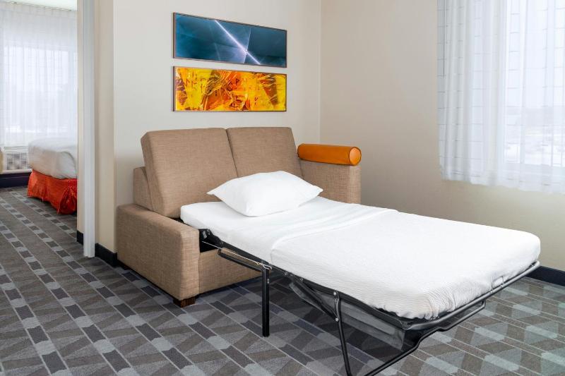One bedroom suite with a queen bed, sofa bed and couryard view image 4