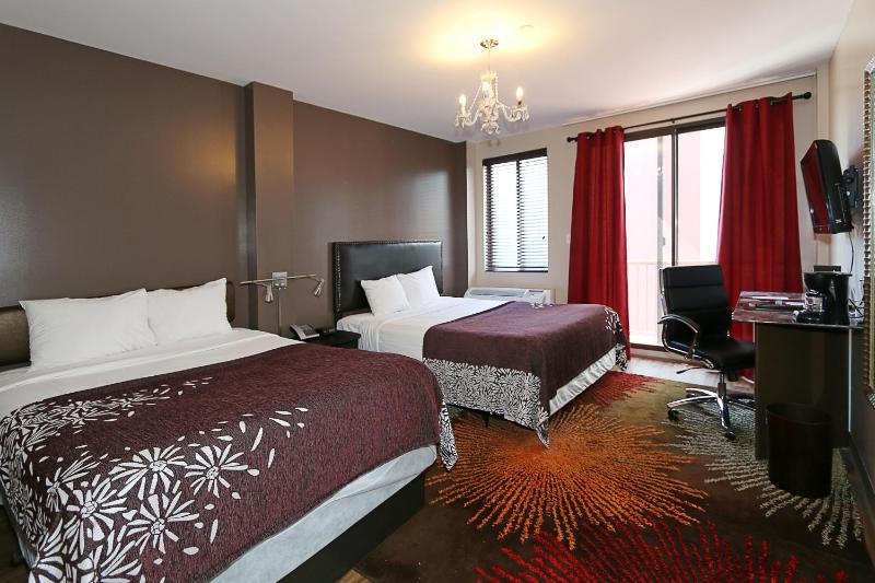 Superior Room One King and One Full Bed and Balcony