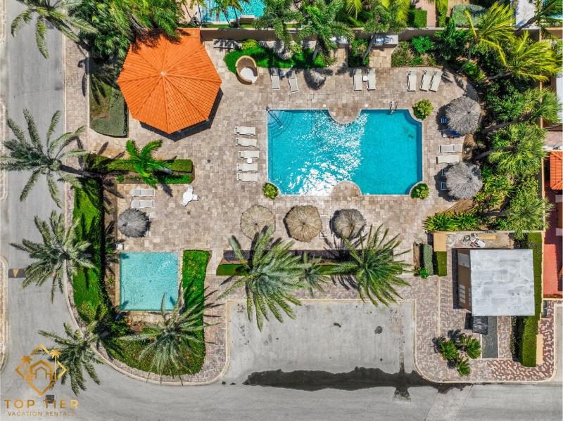 2BR Apt with Private Pool BBQ & 3 Min to Arashi Beach - image 1
