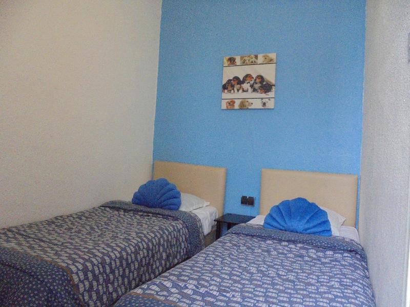 Quadruple Room with Three Beds (2 Adults + 2 Children) image 3