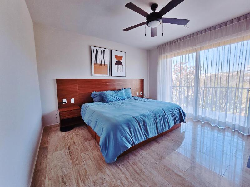 1 BedRoom with King Bed and Balcony with Amenities View - image 2