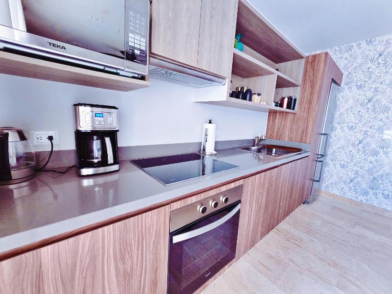 1 BedRoom with King Bed and Balcony with Amenities View - image 13