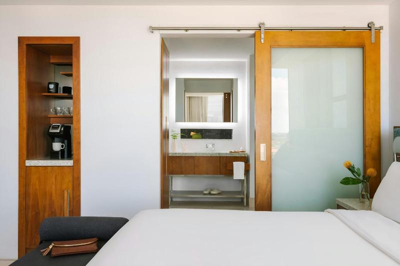 King Room with Balcony - Mobility and Hearing Accessible with Roll-in Shower image 3