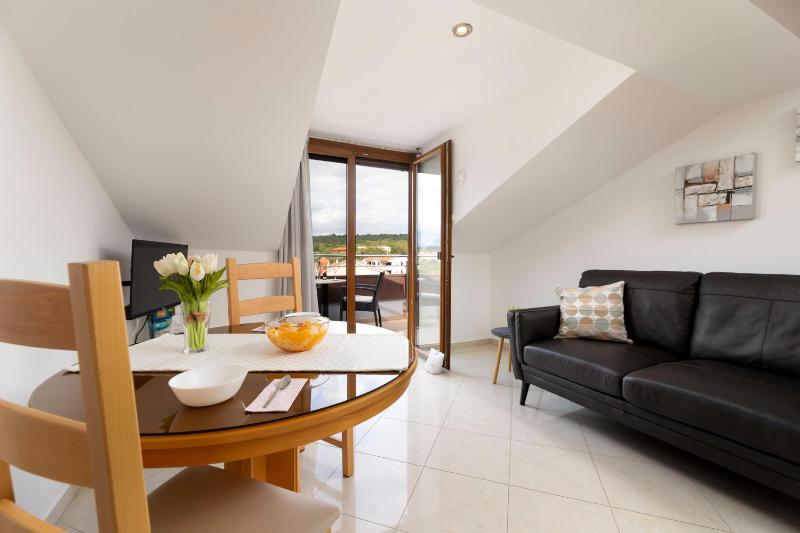 One-Bedroom Apartment with Balcony and Sea View - Attic image 1