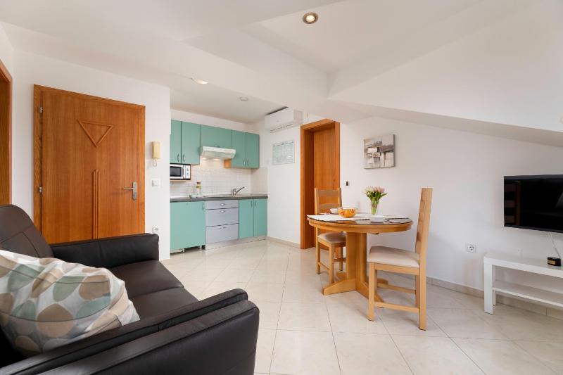 One-Bedroom Apartment with Balcony and Sea View - Attic image 4