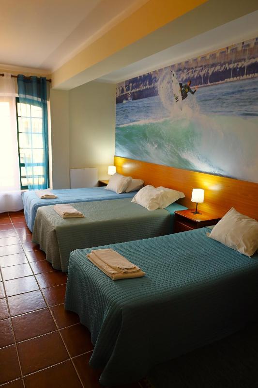 Basic Triple Room with Shared Bathroom image 1
