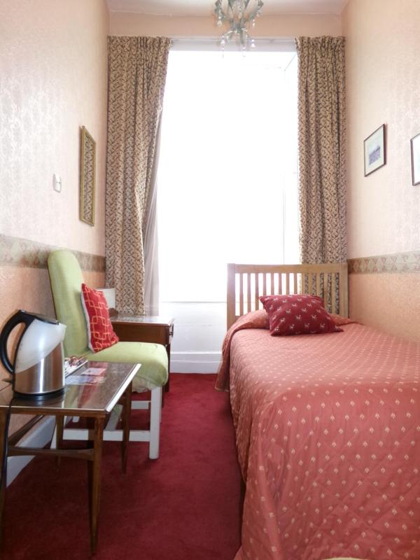 Single room with shared toilet and shower image 1
