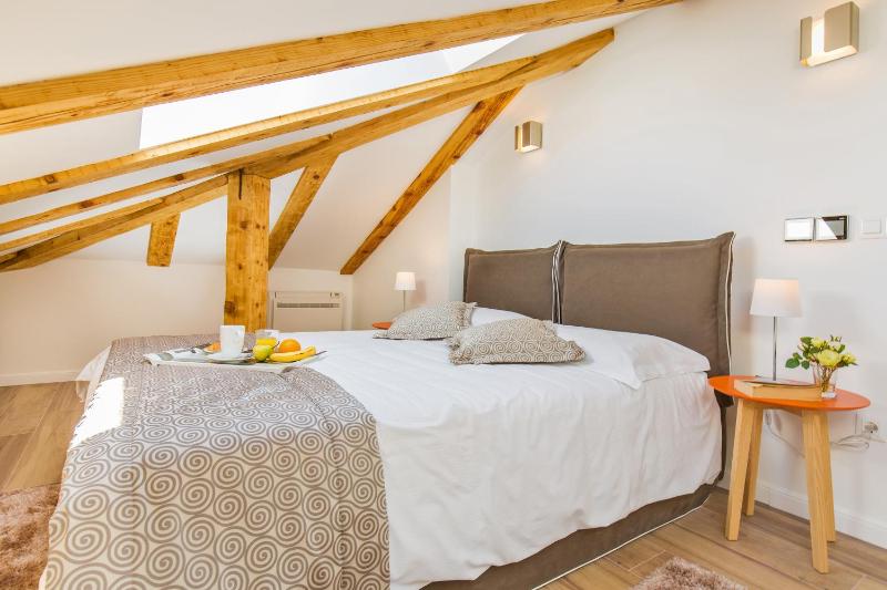 One-Bedroom Apartment with Balcony - Attic image 3