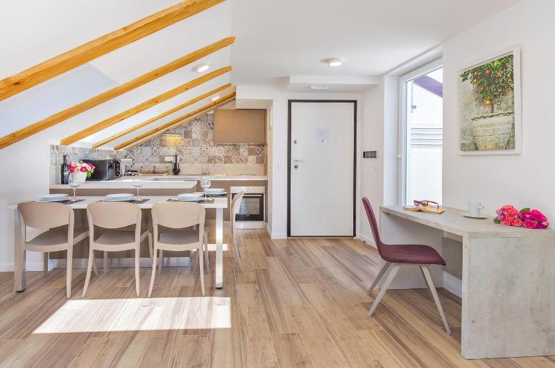 One-Bedroom Apartment with Balcony - Attic image 4