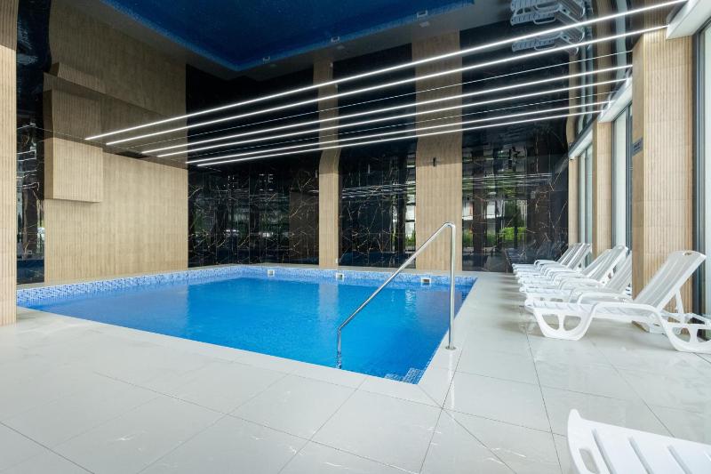 Nadmorski Apartament w Pobierowie z Parkingiem oraz Basenem by Noclegi Renters - image 13