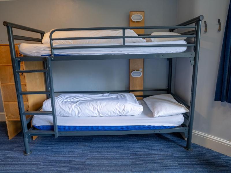 Bunk Bed in Male Dormitory Room with Shared Bathroom image 3