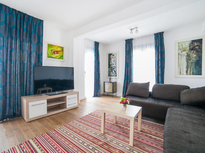 One-Bedroom Apartment with Balcony with Side Sea View image 1
