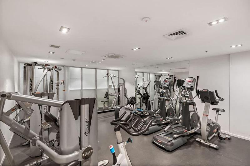 CBD 2BR Retreat w Pool & Gym by Zodiak Stays - image 11