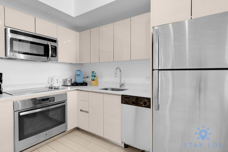 Stylish 2BR High-Rise Retreat w Ocean Views - image 20