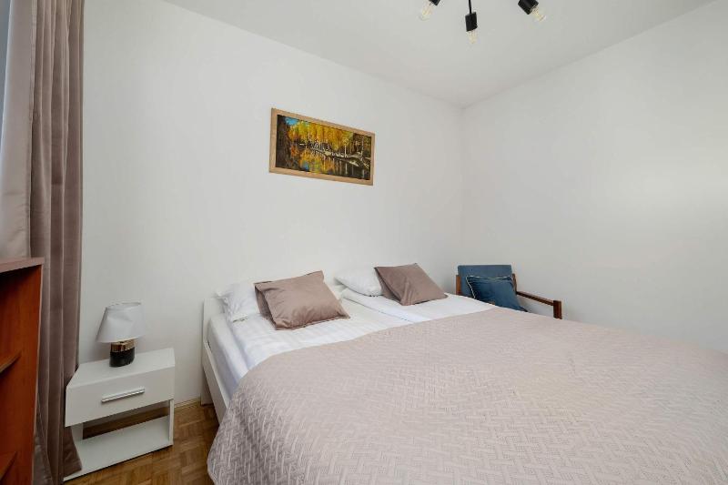 Blue Two Bedroom Apartment in Wrocław with Desk Bathtub and Balcony by Noclegi Renters - image 23