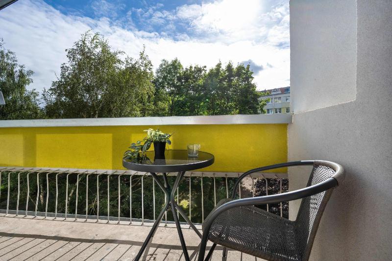 Blue Two Bedroom Apartment in Wrocław with Desk Bathtub and Balcony by Noclegi Renters - image 5