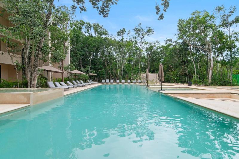 Stylish 1BR Condo with Private Pool & Balcony - image 18