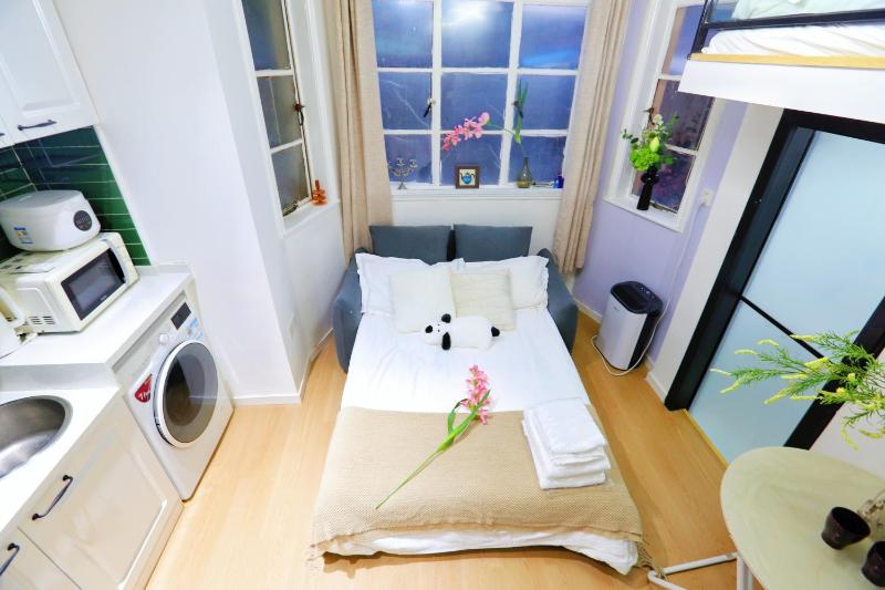 YaoTai - Stylish High-Ceiling Loft with Large Windows & Sofa Lounge - image 11