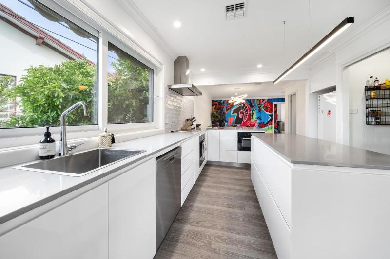 4-Bed Family Home with Spacious Backyard and BBQ - image 3