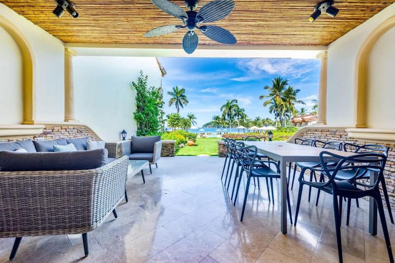 Stylish Split-Level Condo with a Shaded Terrace Direct Beach Access and Resort-Style Community Amenities - image 1