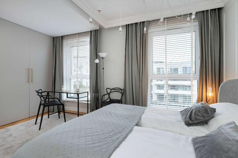Elegant Apartment with Parking Space and Balcony by Noclegi Renters - image 7
