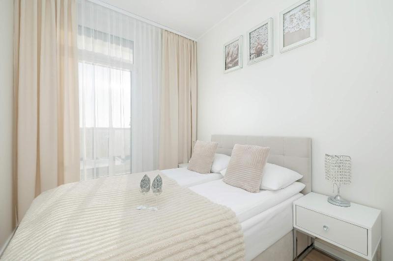 Blue and Beige Apartment in Sianożęty with Seasonal Pool Parking and Balcony by Noclegi Renters - image 12