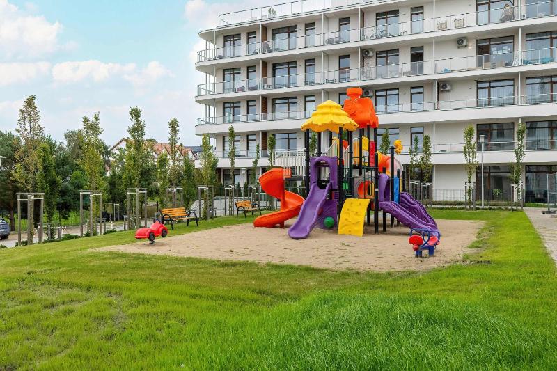 Blue and Beige Apartment in Sianożęty with Seasonal Pool Parking and Balcony by Noclegi Renters - image 13