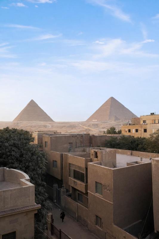 Hathor palace pyramids view - image 5