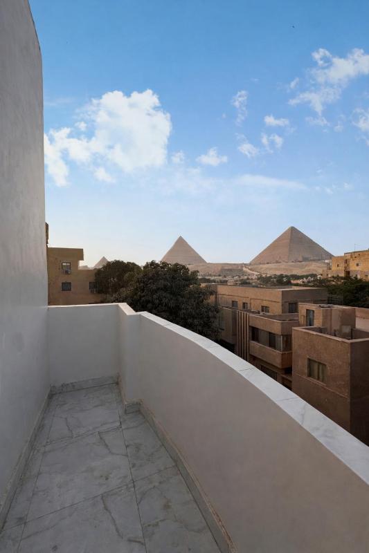 Hathor palace pyramids view - image 15