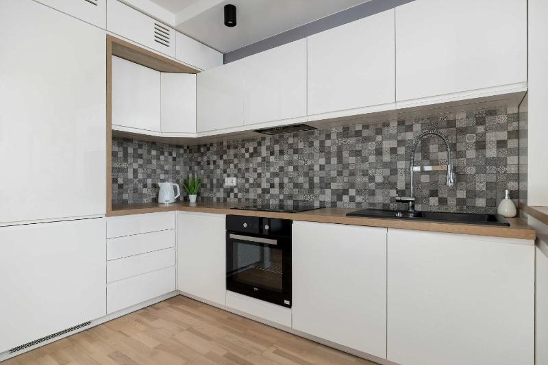 Modern Grey Apartment Close to the Centre of Rzeszów Perfect for Remote Work by Noclegi Renters - image 17