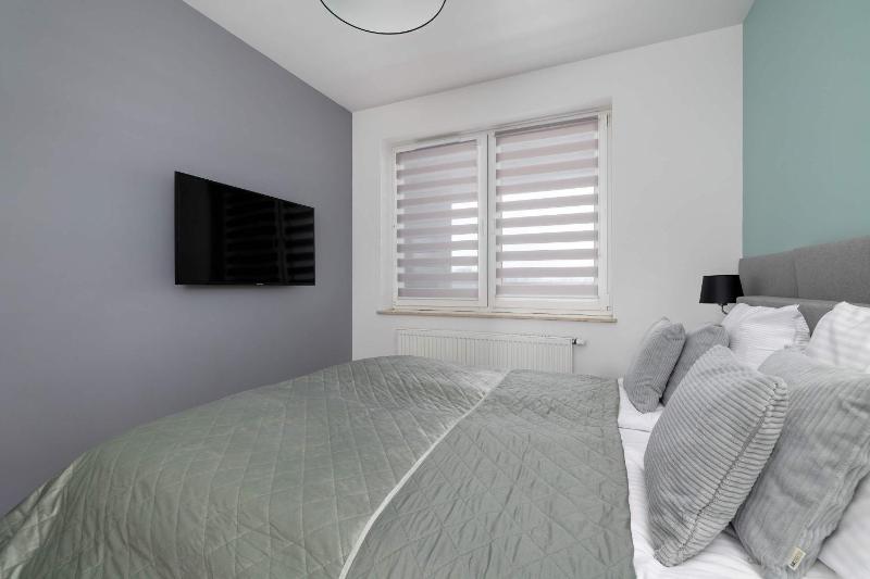 Modern Grey Apartment Close to the Centre of Rzeszów Perfect for Remote Work by Noclegi Renters - image 3